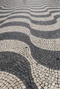 Beautiful Cobblestone pavement forming waves in Lisbon Royalty Free Stock Photo