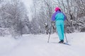 Beautiful cold forest view of ski run track on ski resort, winter day on a slope, pist, nordic skier on the track in winter,