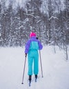 Beautiful cold forest view of ski run track on ski resort, winter day on a slope, pist, nordic skier on the track in winter,