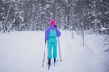 Beautiful cold forest view of ski run track on ski resort, winter day on a slope, pist, nordic skier on the track in winter,