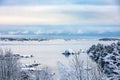 Beautiful winter day at Odderoya in Kristiansand, Norway. Trees covered in snow. The ocean and archipelago in the Royalty Free Stock Photo