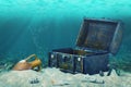 Beautiful collage of closed old wooden treasure chest submerged