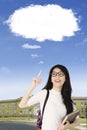 Beautiful college student with empty cloud Royalty Free Stock Photo