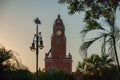 Red brick building tower with golden dome and clock in the City center of Merida. Mexican flag flutters on air. City Town hall of Royalty Free Stock Photo