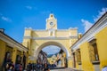 Beautiful colonial style clock arch with people visiting, antigua guatemala city