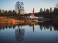 Beautiful color landscape with a blue lake an old castle and reflections in the water in early spring Royalty Free Stock Photo