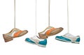 Beautiful color woman shoes hanging on laces with isolated white Royalty Free Stock Photo