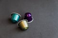 Beautiful colored coffee capsules on black background Royalty Free Stock Photo