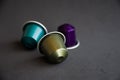 Beautiful colored coffee capsules on black background Royalty Free Stock Photo