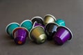 Beautiful colored coffee capsules on black background Royalty Free Stock Photo