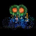 Colored fireworks display on dark sky background. Royalty Free Stock Photo