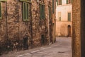 Beautiful colored and medieval street in the old town of Siena, Italy Royalty Free Stock Photo