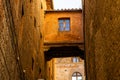 Beautiful colored and medieval street in the old town of Siena, Italy Royalty Free Stock Photo