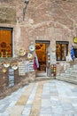 Beautiful colored and medieval street in the old town of Siena, Italy