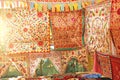 Beautiful colored tablecloths or stoles, fabric hand-embroidered textiles in the market of bazaars in India