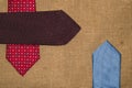 Beautiful colored ties on the old sacking Royalty Free Stock Photo