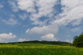 Beautiful and colorful abstract landscape, with rolling hills, green wheat fields and yellow rape fields in South Moravia, Czech Royalty Free Stock Photo