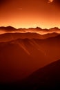 A beautiful, colorful, abstract mountain landscape in a red tonality. Royalty Free Stock Photo