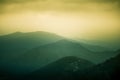 A beautiful, colorful, abstract mountain landscape with a warm green summer haze.