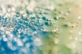 Beautiful colorful background with glitter and colored bubbles in oil and watercolor. Sparkle particles. Macro oil ink bubbles and Royalty Free Stock Photo