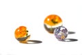 Beautiful colorful background. Handmade violet and orange dried flowers in epoxy resin balls.