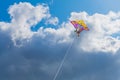 Beautiful colorful butterfly kite against the sky and clouds, freedom vacation travel concept Royalty Free Stock Photo