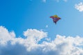 Beautiful colorful butterfly kite against the sky and clouds, freedom vacation travel concept Royalty Free Stock Photo