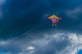 Beautiful colorful butterfly kite against the sky and clouds, freedom vacation travel concept Royalty Free Stock Photo