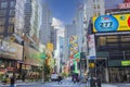 Beautiful colorful cityscape view of downtown Broadway of New York on bright day. Advertising on skyscrapers on blue sky. Royalty Free Stock Photo