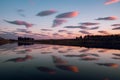 Beautiful colorful clouds and reflection on calm river water Royalty Free Stock Photo