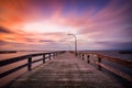 Beautiful colorful clouds streaking over a pier at sunset.  Jones Beach - Long Island NY Royalty Free Stock Photo