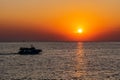 Beautiful, colorful and contrasting sunset over the sea, ocean. The hot sun illuminates the spacious landscape, casting the glare Royalty Free Stock Photo