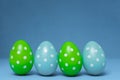 Beautiful colorful easter eggs on blue background Royalty Free Stock Photo