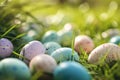 Beautiful colorful eggs and flowers in spring grass meadow over blue sky with sun Royalty Free Stock Photo