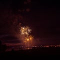 Beautiful, colorful fireworks above the river during an Independence day Royalty Free Stock Photo