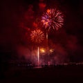 Beautiful, colorful fireworks above the river during an Independence day Royalty Free Stock Photo