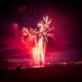 Beautiful, colorful fireworks above the river during an Independence day Royalty Free Stock Photo