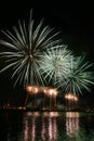 Beautiful, colorful fireworks above the river during an Independence day Royalty Free Stock Photo