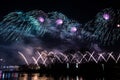 Beautiful, colorful fireworks above the river during an Independence day Royalty Free Stock Photo