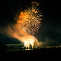 Beautiful, colorful fireworks above the river during an Independence day Royalty Free Stock Photo