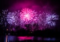 Beautiful, colorful fireworks above the river during an Independence day Royalty Free Stock Photo