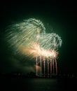 Beautiful, colorful fireworks above the river during an Independence day Royalty Free Stock Photo