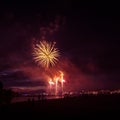 Beautiful, colorful fireworks above the river during an Independence day Royalty Free Stock Photo