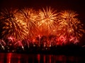 Beautiful, colorful fireworks above the river during an Independence day Royalty Free Stock Photo