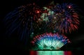 Beautiful colorful fireworks display on celebration night, showing on the sea beach with multi color of reflection on water Royalty Free Stock Photo