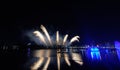 Beautiful colorful fireworks display on the urban lake for celebration on dark night background Royalty Free Stock Photo