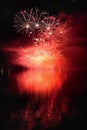 Beautiful colorful fireworks on the water surface with a clean black background. Fun festival and international contest of Firefig Royalty Free Stock Photo