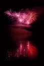 Beautiful colorful fireworks on the water surface with a clean black background. Fun festival and international contest of Firefig Royalty Free Stock Photo