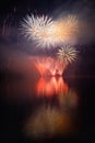 Beautiful colorful fireworks on the water surface with a clean black background. Fun festival and international contest of Firefig Royalty Free Stock Photo