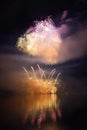 Beautiful colorful fireworks on the water surface with a clean black background. Fun festival and international contest of Firefig Royalty Free Stock Photo